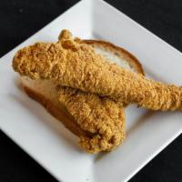 Catfish Sandwich · Two catfish fillets with two slices of bread.
