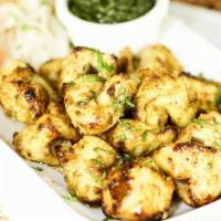Achari Boti · A Pakistani classic! Boneless chicken smothered in a tangy fennel seed marinade. Served with...