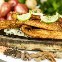 Fish Tandoori · Pakistani-style fish marinated in coriander, all-spice, and red-chili flakes. The pride of L...