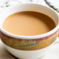 House Chai · Traditional milk tea brewed with a hint of fennel, cardamom, cinnamon.