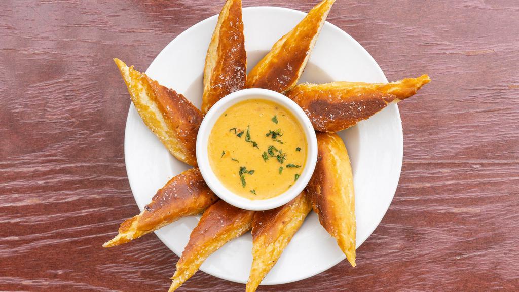 Shillelagh Sticks · Pretzel sticks served with a side of our decadent house IPA-beer cheese sauce.