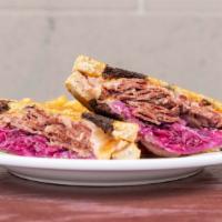 Classic Reuben · House-made corned beef, swiss, 1000 island dressing and fresh purple kraut, toasted on a mar...