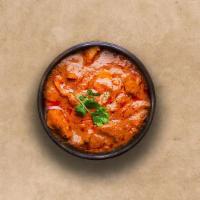 Tangy Chicken Tikka Masala · Oven-roasted chicken chunks in a rich creamy tomato and onion based gravy.