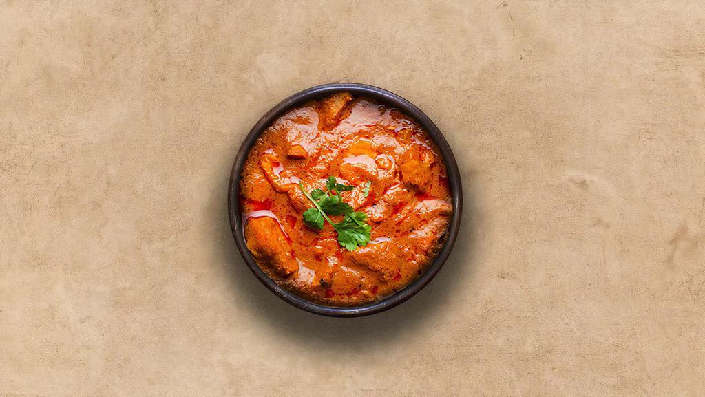 Tangy Chicken Tikka Masala · Oven-roasted chicken chunks in a rich creamy tomato and onion based gravy.