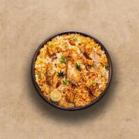 Spice Lane Chicken Biryani · Long grain basmati rice cooked with tender chicken and aromatic Indian herbs.