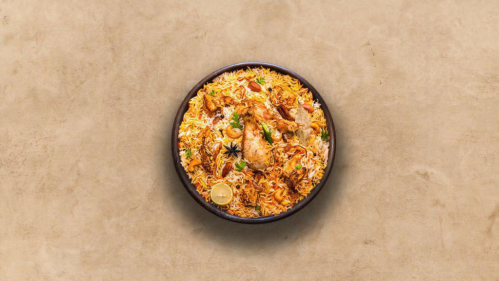 Spice Lane Chicken Biryani · Long grain basmati rice cooked with tender chicken and aromatic Indian herbs.