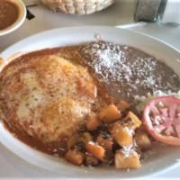 Huevos Rancheros · Two eggs over easy on top of a corn tortilla covered with ranchero sauce and cheese. Served ...