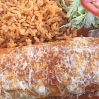 Beef Burrito · Shredded beef with beans and cheese inside, enchilada style.