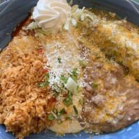 Mi Pueblo Enchilada · Chicken, beef and cheese enchiladas topped with our 3 different sauces.