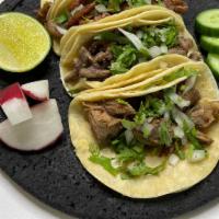 #2 Taco Special With Rice & Beans · 3 tacos served with your choice of meat, with cilantro, onion, lime, radish, and cucumber, a...