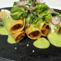 Flautas De Barbacoa (*Weekends Only*) · Deep-fried homemade tortillas rolled with lamb, topped with guacamole sauce, lettuce, tomato...