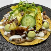 Tostada Sencilla · Crispy tortilla with beans, your choice of meat, onion, lettuce, tomato, sour cream, and che...