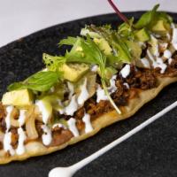 Huarache · Fresh, homemade oblong corn tortillas (the classic edible Mexican sandal), beans, your choic...