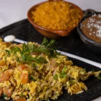 Huevos A La Mexicana · Scrambled eggs mixed with diced tomato, green & white onion, comes with rice & beans