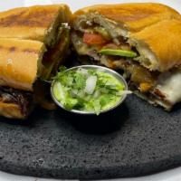 Torta Milanesa · French bread with 10 oz. of breaded steak with beans, chipotle, milk cheese, tomato, avocado...