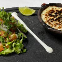 Queso Fundido · Molten mozzarella cheese dip with your choice of corn or flour tortillas and a side of pico ...