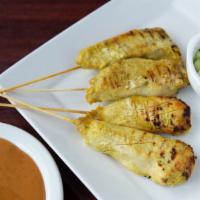 Chicken Satay · Marinated with curry and coconut milk, served on a skewer with peanut sauce.