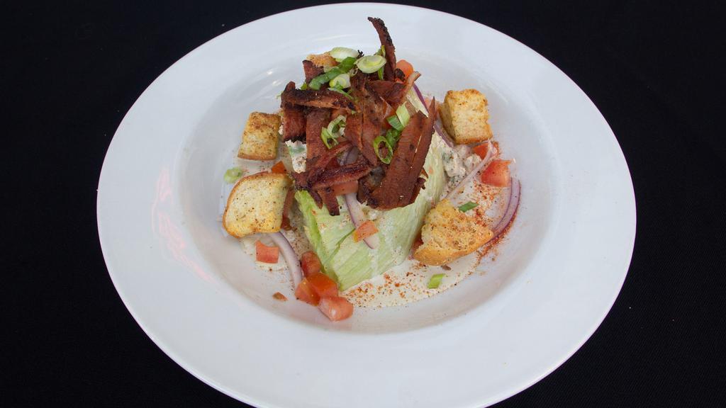 The Wedge · Bacon, tomato, red onion, and croutons with blue cheese dressing.