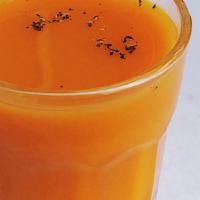 Turmeric Immunity Shot · Organic raw, cold pressed turmeric shots topped with cracked black pepper