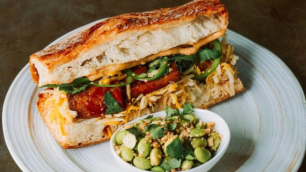 Bahn Mi Sandwich · Baked Tamari-glazed tofu, spicy vegan mayo, jalapenos, cilantro & pickled carrots