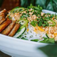 Thai Peanut Salad · Seasoned rice noodles, Tamari-glazed tofu, pickled carrot, cucumber, jalapeno, cilantro & mi...