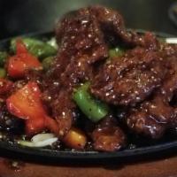 Black Pepper Steak Sizzling Plate · Deep-fried. Beef with onion, bell pepper, mushroom in special black pepper sauce on sizzling...