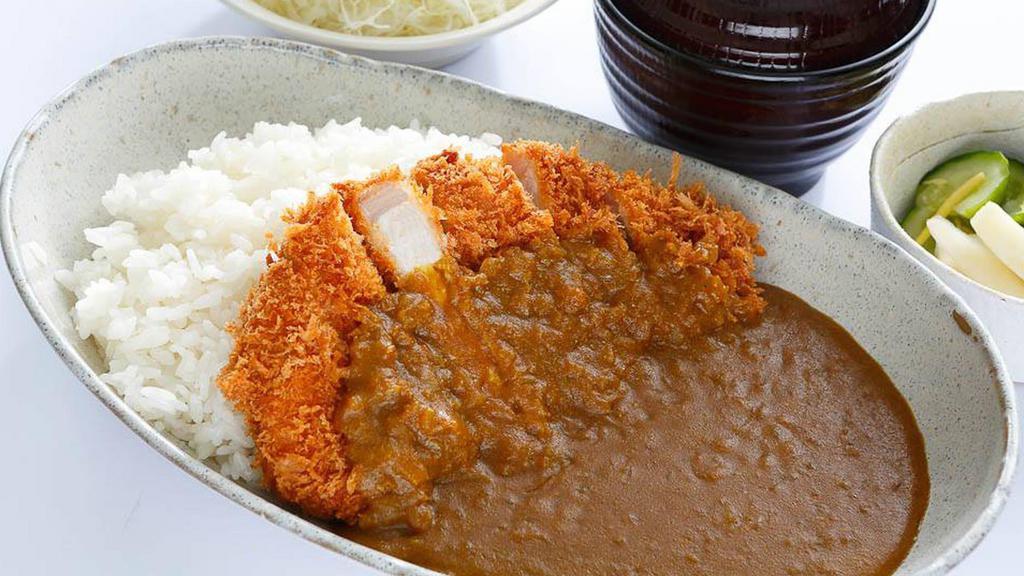 Chicken Katsu Curry · Tender slice chicken with carrots, diced bell pepper and onion stir fried in a yellow curry sauce.