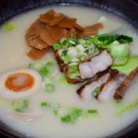 Tonkotsu Ramen · Noodle soup topped with 2 pcs of chashu, soft-boiled egg, bean sprouts, and bamboo shoots; s...