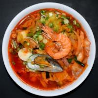 Spicy Seafood Ramen · Noodle soup topped with head-on shrimp, mussels, clams, calamari, and stir-fried veggies; se...