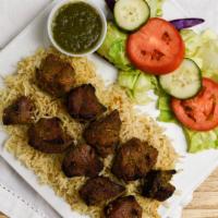 Tekka Kabob · Two skewers of lamb or beef pieces marinated in special herbs and spices and broiled over th...