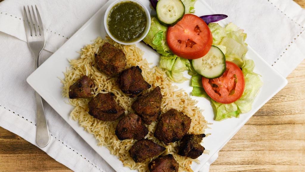 Tekka Kabob · Two skewers of lamb or beef pieces marinated in special herbs and spices and broiled over the grill (kababs are served with a side of bread or basmati rice or salad).
