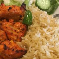 Chicken Kabob · Two skewers of tender chunks of chicken breast, marinated in special herbs, spices and broil...
