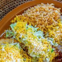Beef Burrito & Cheese Enchilada · Served with rice and beans.