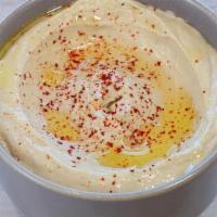 Hummus App · Mashed chickpeas, blended with tahini, olive oil, lemon juice, salt, garlic, and spices. Ser...
