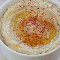 Baba Ganoush App · Grilled  eggplant mixed with tahini, olive oil,  lemon juice, and seasonings. Served with pi...