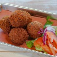 Falafel(5 Pcs.) · Falafel is a deep-fried ball, made from ground chickpeas, fava beans, herbs, and spices garn...