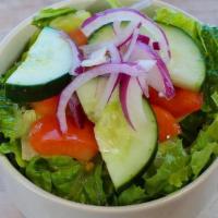 Garden Salad · A simple salad with lettuce, tomatoes, onions, and cucumbers, served with our traditional gr...