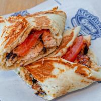 Garlic Chicken Press · Chicken kebab wrapped and pressed in pita bread with tomatoes and garlic sauce.