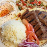 Beef & Lamb Gyro Plate · Our most popular plate. Sliced gyro with tzatziki sauce. Served with hummus, Israeli salad, ...