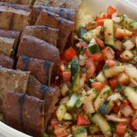 Beef & Lamb Gyro Bowl · Gyro slices served with rice, Israeli salad, tzatziki sauce and pita.