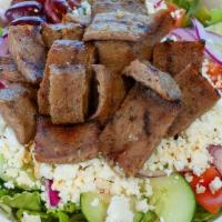 Beef & Lamb Gyro Salad · Served with lettuce, tomatoes, onions, cucumbers, feta cheese, olives, tzatziki sauce and pi...