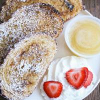 French Toast · 2 slices of French toast with butter, powdered sugar, fruit, whip cream and old fashioned bu...