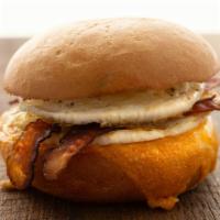 Bacon, Egg & Cheese Sandwich · Applewood-smoked bacon, 2 cage free eggs, mild cheddar cheese, salt and pepper on a French b...