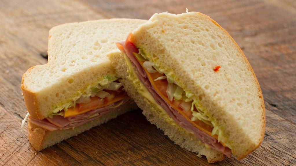 Smoked Ham & Cheddar · Mustard/mayonnaise sauce, lettuce and tomato.
