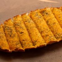 Garlic Bread · Half a loaf of our sweet french bread with our homemade garlic butter spread. toasted and cu...