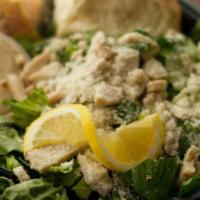 Chicken Caesar Salad · Romaine lettuce, chicken, parmesan cheese, seasoned croutons and creamy Caesar dressing.