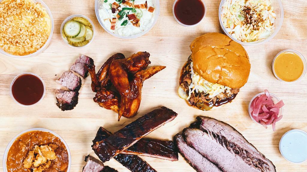 Barbecue Family Meal · Two meats and three sides-enough for two adults and two kids. Two sauces, jalapeño-IPA pickles, and pickled red onions all included. Also included are two banana puddings. Choose which two meats and which three sides.