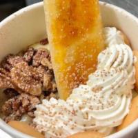 Small Banana Pudding · Scratch made banana pudding topped with vanilla bean whipped cream, mini Nilla wafers, and c...