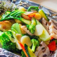 Lotus Delight · Assortment of mixed veggies and lotus roots stir-fried in our house-blended garlic ginger sa...