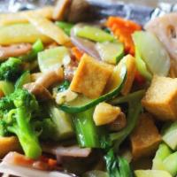 Kung Pao Tofu · Tofu and veggies stir-fried in our spicy house-blended soy sauce with roasted peanuts.